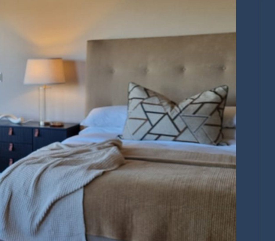 Bed, bedside joinery and lamp detail
