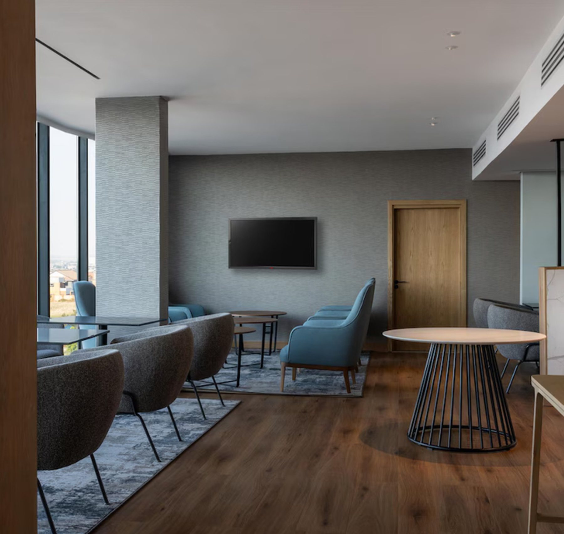 Suite living area with dining and lounge furniture