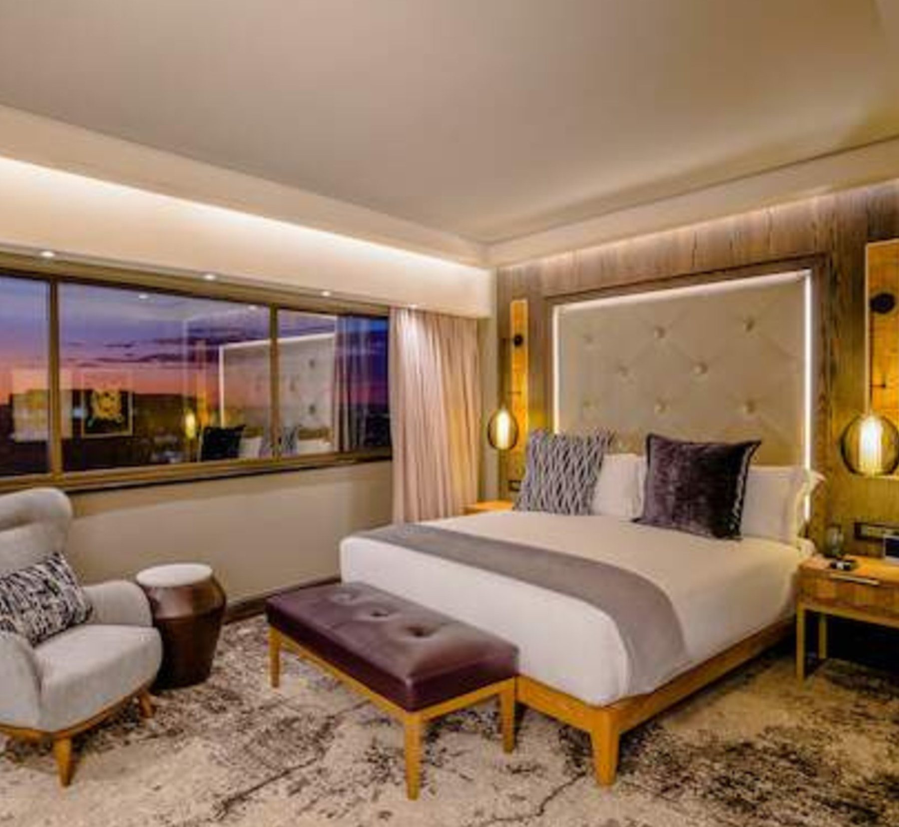 Sandton Towers — Presidential and executive suites — casegoods, upholstered headboards, screens, brassware detailing and restaurant seating in a five-star envelope.