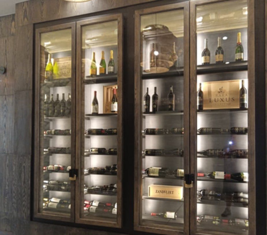Wine display cabinetry, lit and glazed