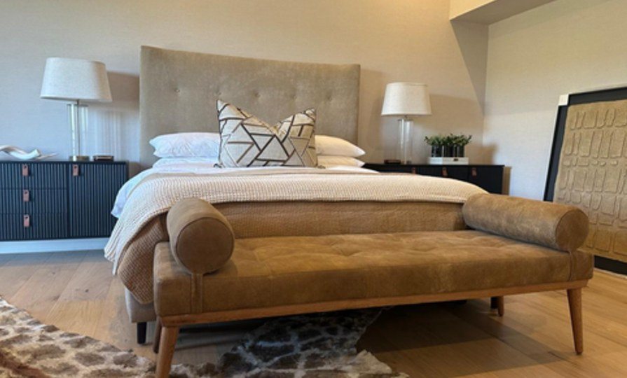 Bedroom with upholstered bench at the foot of the bed