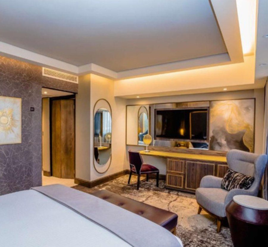 Dressing area, desk and lounge chairs