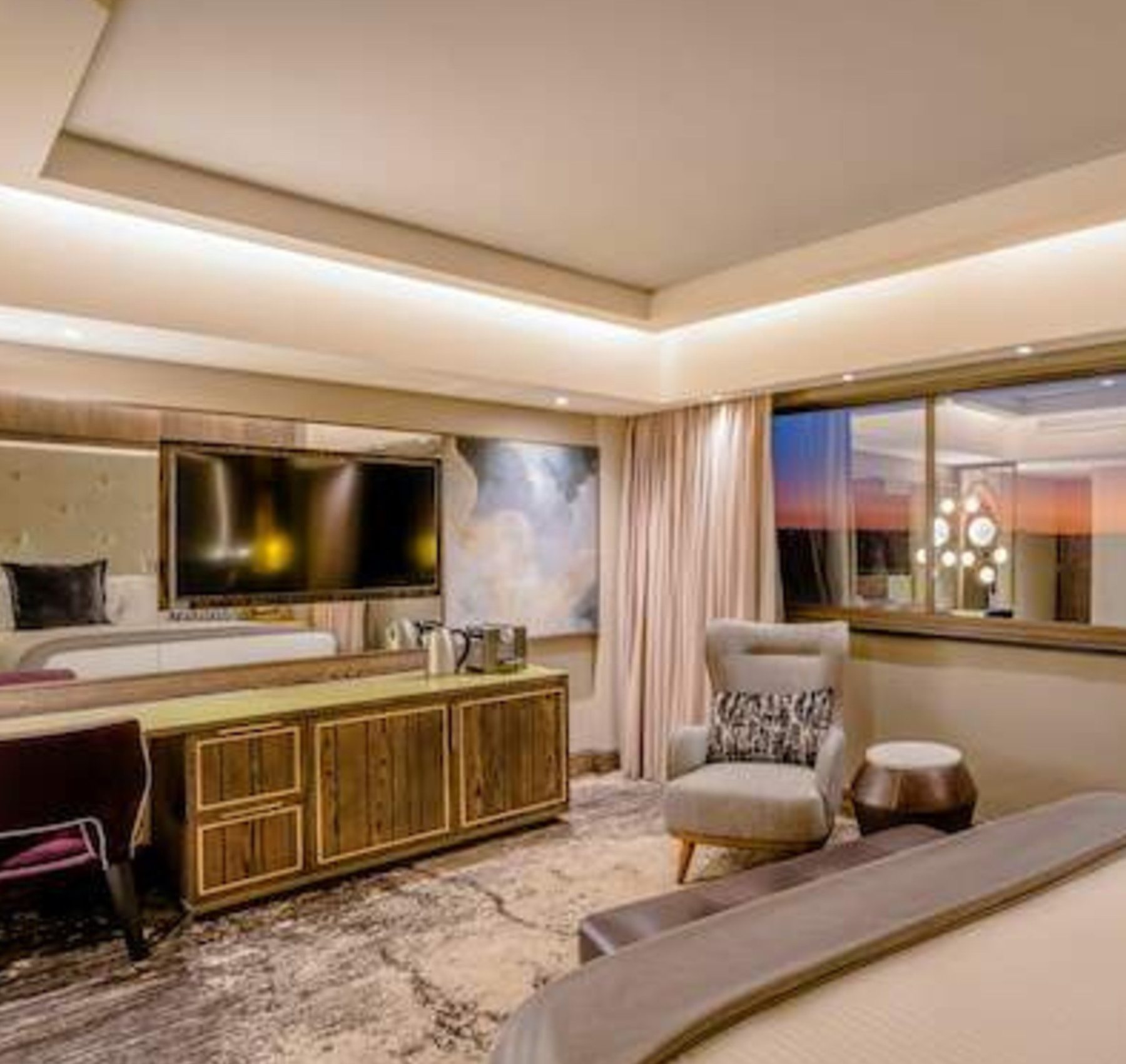 Suite bedroom with veneered media console