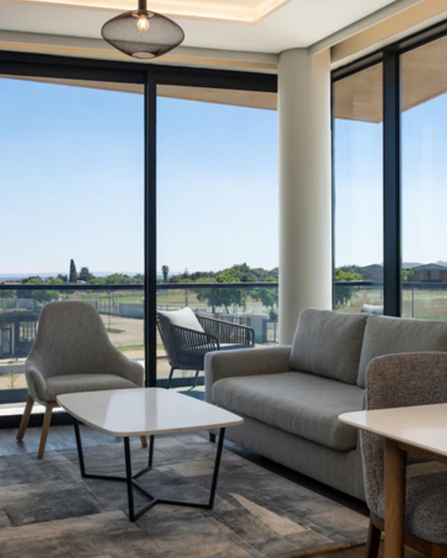 Terrace suite lounge with view over the city edge