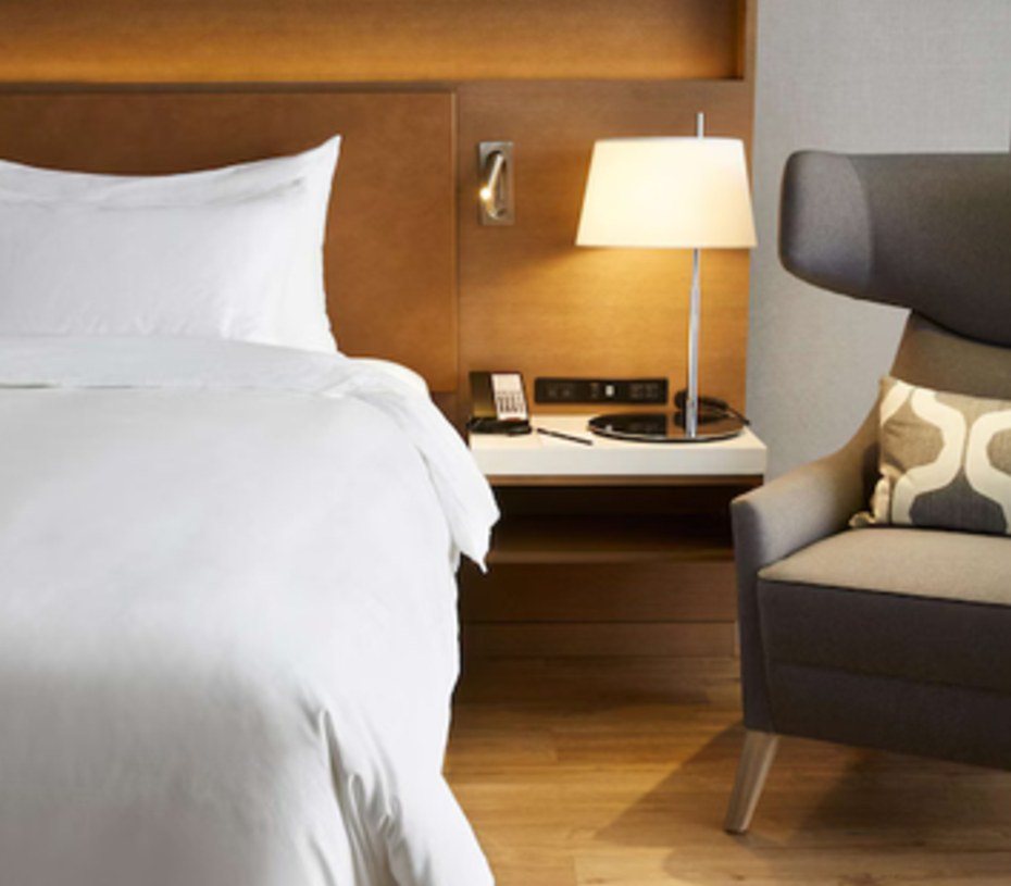 Bedside joinery, lamp and lounge chair